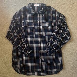 Navy, orange, white, and green flannel